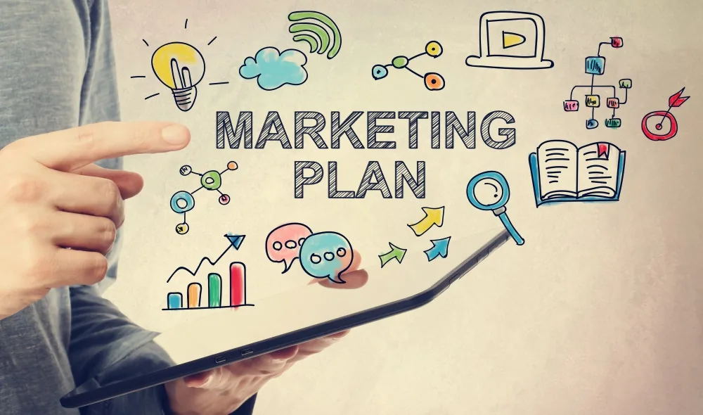 A marketing plan on a desk, representing the strategy and plan that follow the objectives